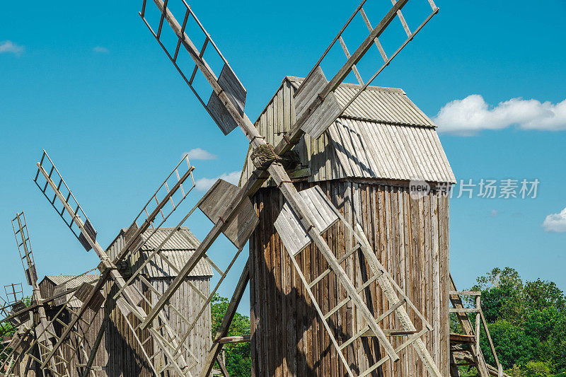 Characteristic landscape on the island of Öland (Sweden) with old wooden mill. This location is Störlinge Kvarnrad: a row of seven windmills on the eastern coastal road.